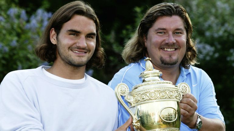 Roger Federer poses with the trophy with his coach Peter Lundgren after Wimbledon 2003