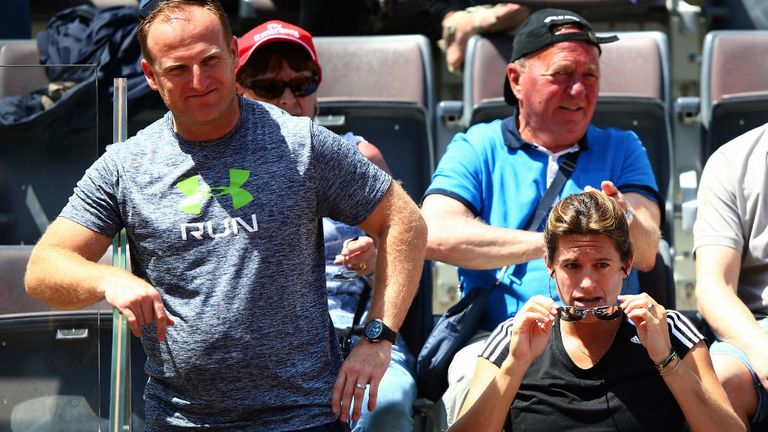 Fitness trainer Matt Little and Amelie Mauresmo coach of Andy Murray watches him from the team bench during his match against Jeremy Chardy