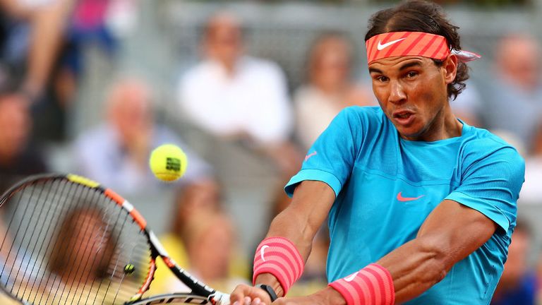 Rafael Nadal plays a backhand against Andy Murray in the mens final during day nine of the Mutua Madrid Open