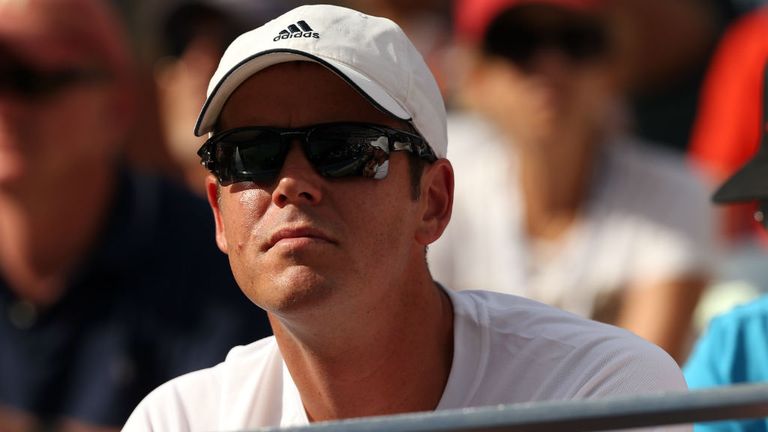 Magnus Norman watches Stan Wawrinka play Kei Nishikori of Japan during their men's singles quarter-final match at the US Open