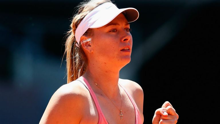 Maria Sharapova celebrates defeating Caroline Garcia at the Mutua Madrid Open at the Caja Magica