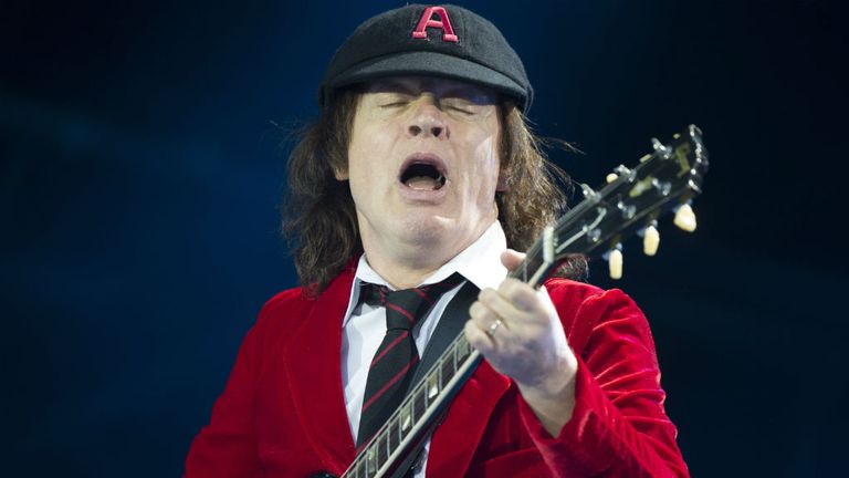 British guitar player Angus Young, of AC/DC performs on the stage of the Stade de France during their 'Rock or Burst World Tour'