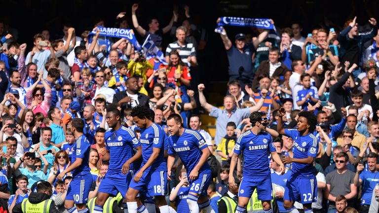 Chelsea players and fans celebrate the opening goal scored by Chelsea's John Terry.