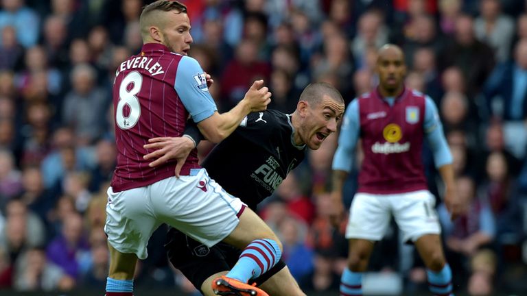 Tom Cleverly and David Jones battle for the ball