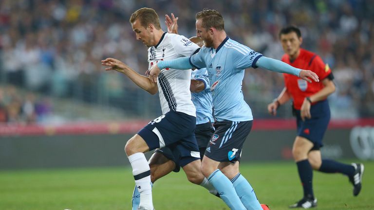 Harry Kane of Tottenham Hotspur takes the ball past Rhyan Grant of Sydney FC  during the international friendly match
