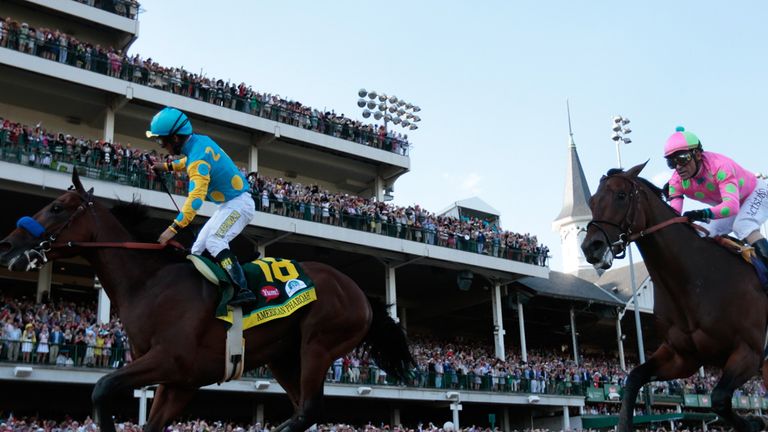 LOUISVILLE, KY - MAY 02:  Jockey Victor Espinoza celebrates as he guides American Pharoah #18 after crossing the finish line to win the 141st running of th