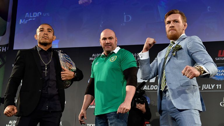 President Dana White (C) separates UFC Featherweight Champion Jose Aldo of Brazil (L) and title challenger Conor 'The Notorious' McGregor