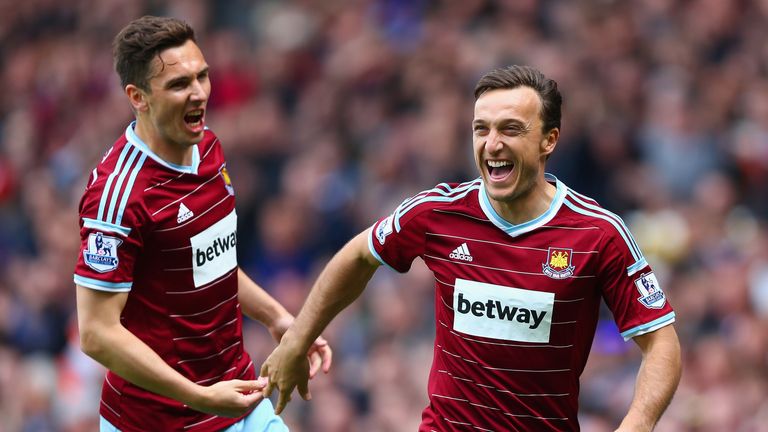 LONDON, ENGLAND - MAY 02:  Mark Noble of West Ham United celebrates scoring his team's first goal from the penalty spot with his team mate Stewart Downing.
