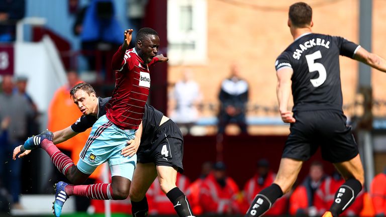 LONDON, ENGLAND - MAY 02: Cheikhou Kouyate of West Ham United is brought down by Michael Duff of Burnley leading to a penalty during the Barclays Premier L
