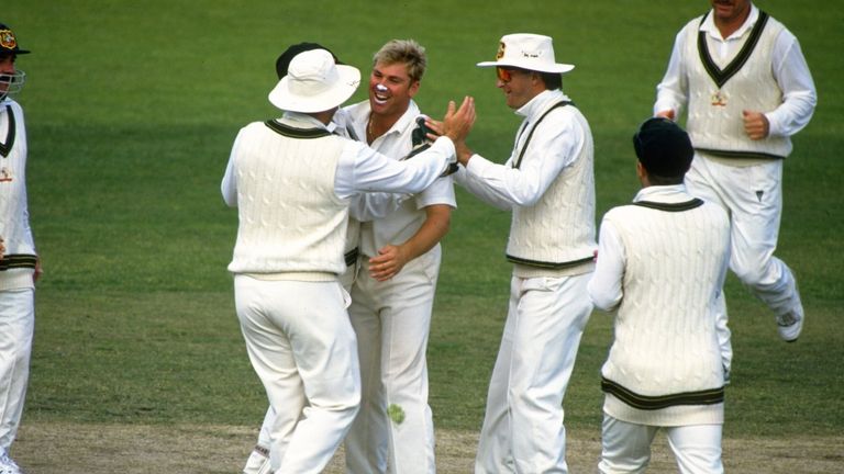 26-30 Nov 1993:  Shane Warne of Australia is congratulated by team mates after taking a wicket during the Second Test match against New Zealand at the Bell