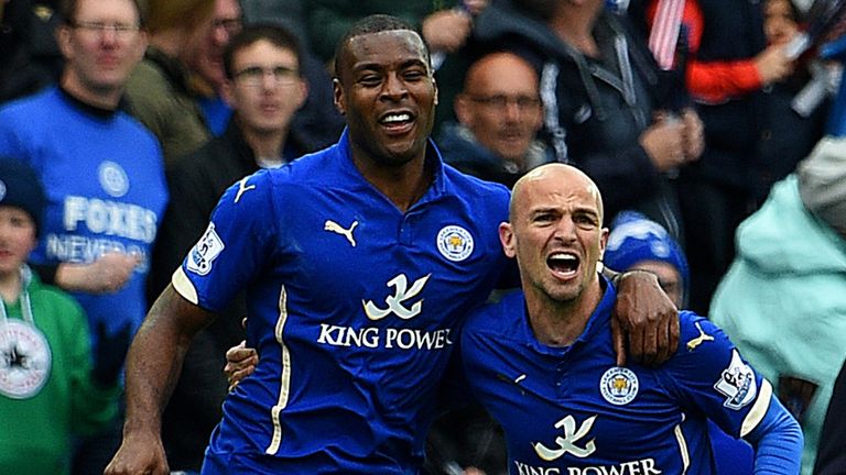 Wes Morgan and Esteban Cambiasso celebrate following Leicester's second goal against Newcastle