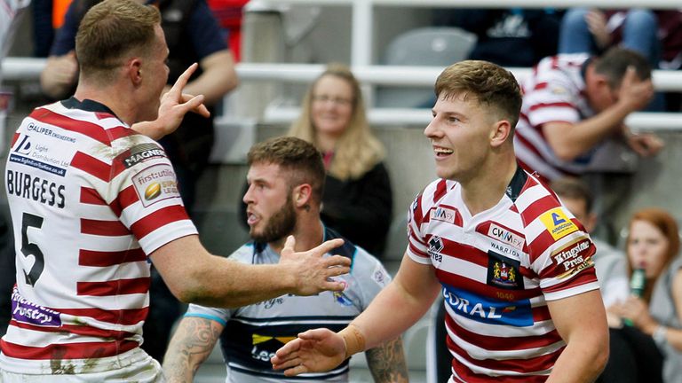 Wigan Warriors' George Williams  (right) and Joe Burgess celebrate scoring against Leeds at Magic Weekend