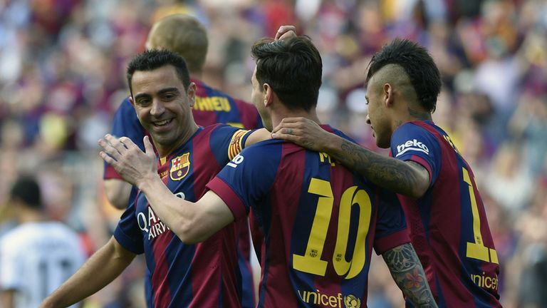 Xavi, Lionel Messi and Neymar celebrate