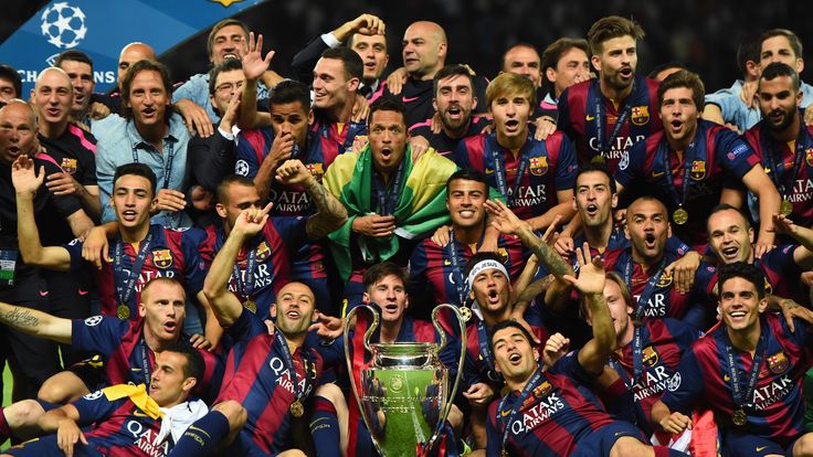 Barcelona celebrate victory with the trophy after the UEFA Champions League Final between Juventus and FC Barcelona
