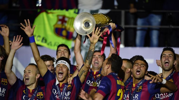 Barcelona's players celebrate with the trophy after the UEFA Champions League Final