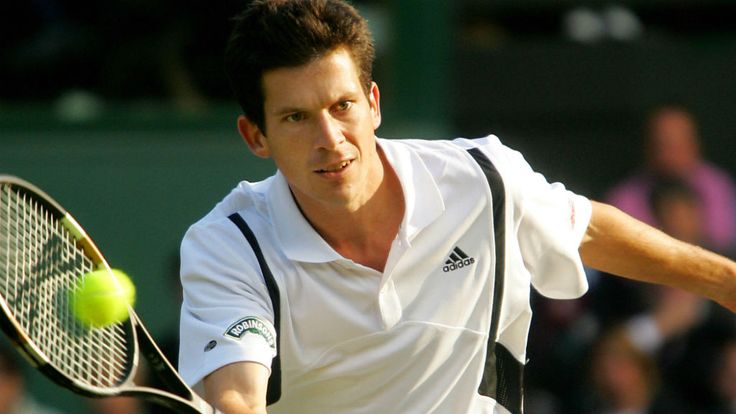 Tim Henman hits a backhand to Mark Philippoussis during the 118th Wimbledon Tennis Championships