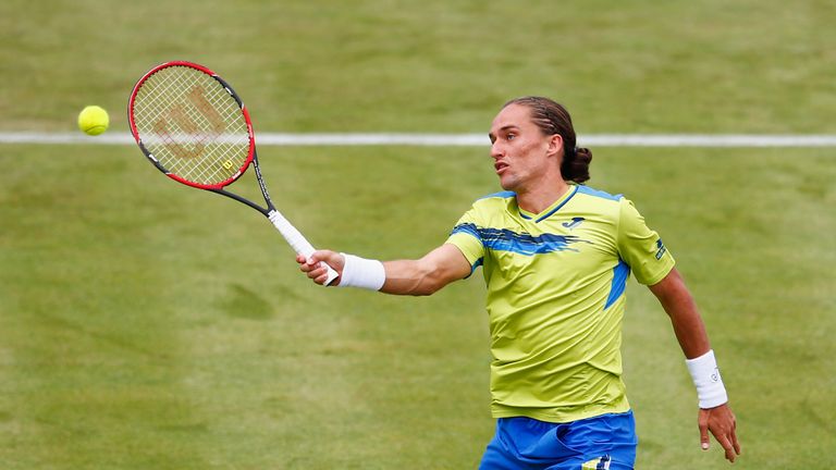 Alexandr Dolgopolov of Ukraine volleys in his men's singles first round match against Rafael Nadal of Spain