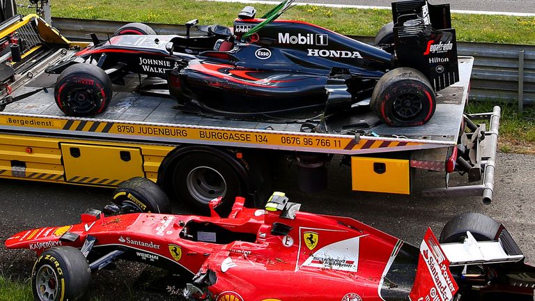 The wrecked cars of Fernando Alonso and Kimi Raikkonen 