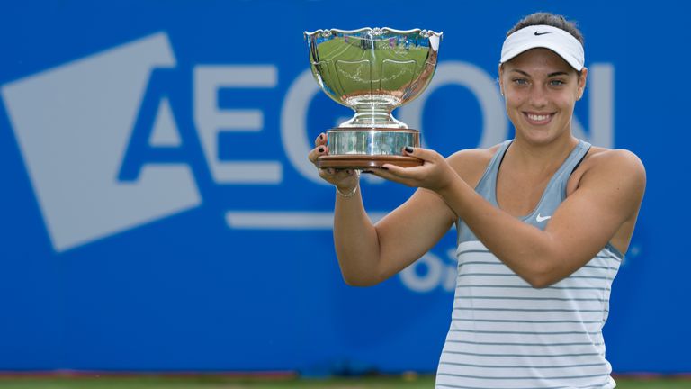 Ana Konjuh of Croatia celebrates winning the Aegon Open Nottingham against Monica Niculescu of Romania with the Elena Baltacha Trophy 
