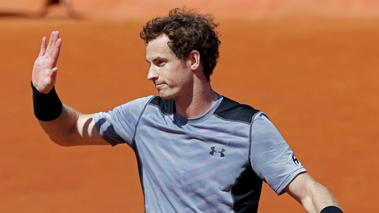Andy Murray celebrates reaching the fourth round