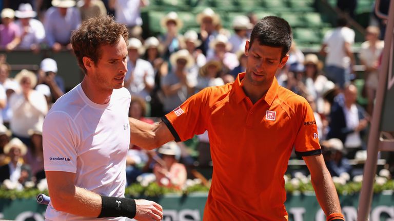 Andy Murray (L) congratulates Novak Djokovic