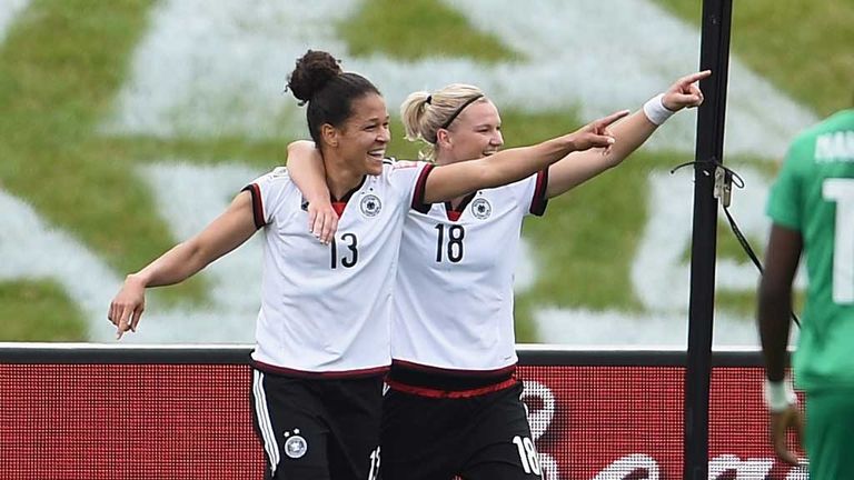 Germany's Anja Sasic (13) celebrates a goal against Ivory Coast with team-mate Alexandra Popp