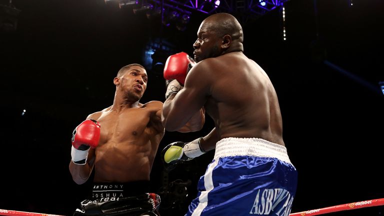 LONDON, ENGLAND - MAY 30:  Anthony Joshua of England and Kevin Johnson of The USA exchange blows during their WBC International Heavyweight bout at The O2 