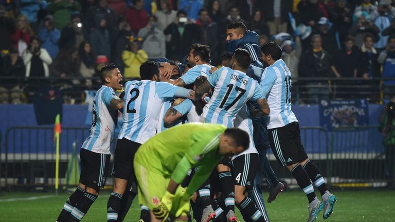 Argentina's players celebrate near Colombia's goalkeeper David Ospina 