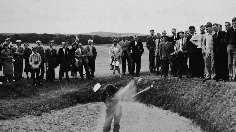 Arnold Palmer drives out of a sand trap during the Open.