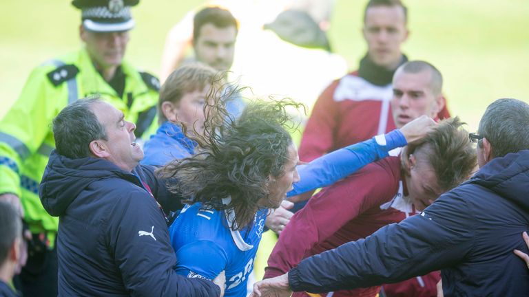Bilel Mohsni of Rangers clashes with Motherwell players 