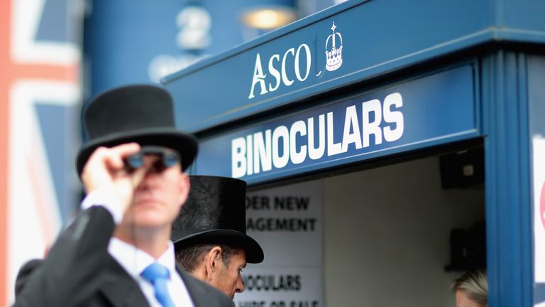 ASCOT, ENGLAND - JUNE 17:  Men in morning dress try binoculars on day 2 of Royal Ascot at Ascot Racecourse on June 17, 2015 in Ascot, England.  (Photo by C