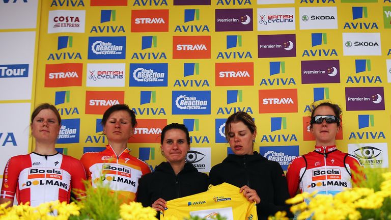 The Boels Dolmans Cycling Team of Elizabeth Armitstead accept the race leader's jersey on her behalf.