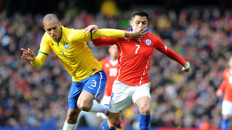 Miranda in action with Chile's Alexis Sanchez