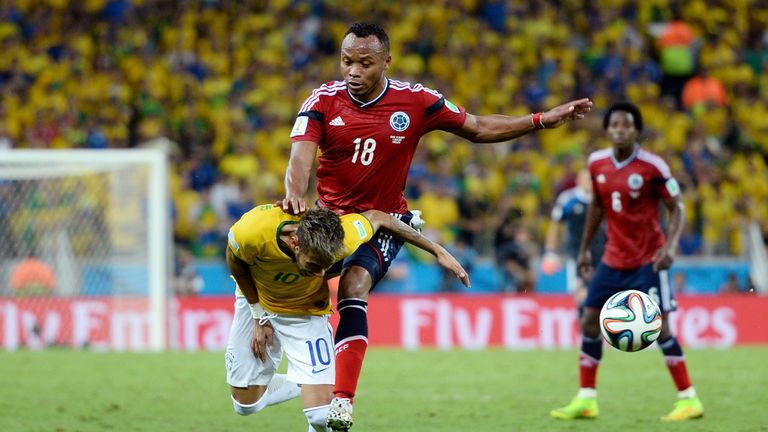 FORTALEZA, BRAZIL - JULY 04: Neymar of Brazil is challenged by Juan Camilo Zuniga of Colombia during the 2014 FIFA World Cup Brazil Quarter Final match bet