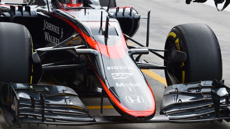 Button's McLaren remains fitted with the old 'long-form' nose