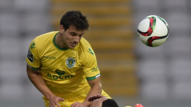 Sporting's defender Cedric Soares (top) jumps with Moreirense's Brazilian forward Leandro Souza during the Portuguese league football match 