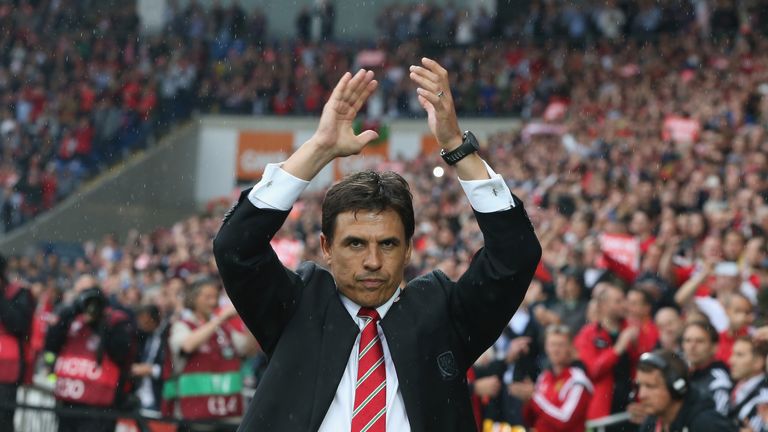 Chris Coleman the Wales manager waves to the crowd during the UEFA EURO 2016 qualifying match between Wales and Belgium at the C