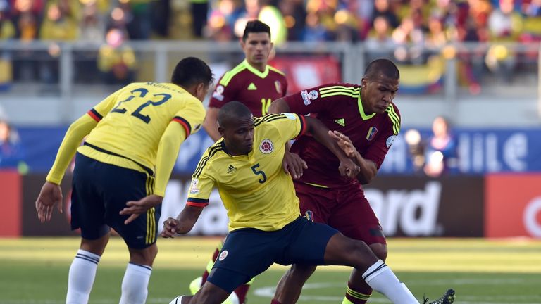 Colombia's midfielder Edwin Valencia and Venezuela's forward Jose Rondon vie for the ball during their 2015 Copa America football championship match.