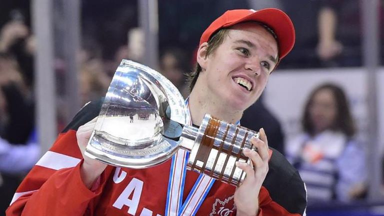 Canada's Connor McDavid skates with the trophy following his team's gold medal victory over Russia at the 2015 IIHF World Junior Championship in Toronto