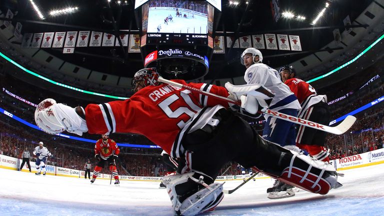 Chicago's Corey Crawford makes a save against the Tampa Bay Lightning.