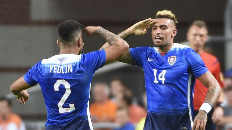 Danny Williams (R) celebrates with DeAndre Yedlin (L) after scoring against the Netherlands