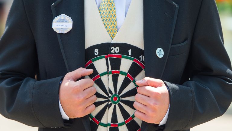 Racegoer Michael Roy wears a darts themed waistcoat