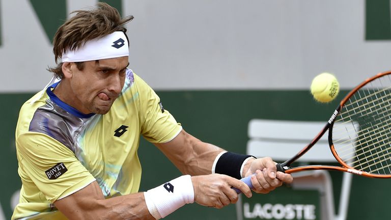 Spain's David Ferrer hits a return to Croatia's Marin Cilic