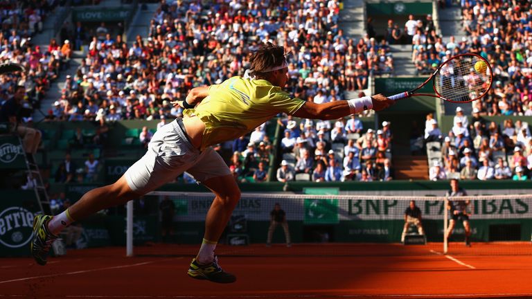 David Ferrer stretches for the ball