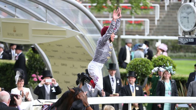 Frankie Dettori celebrates by jumping off Osaila 