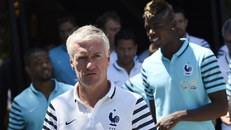 France's head coach Didier Deschamps leaves his hotel with his players in Tirana on June 13, 2015, ahead of the 