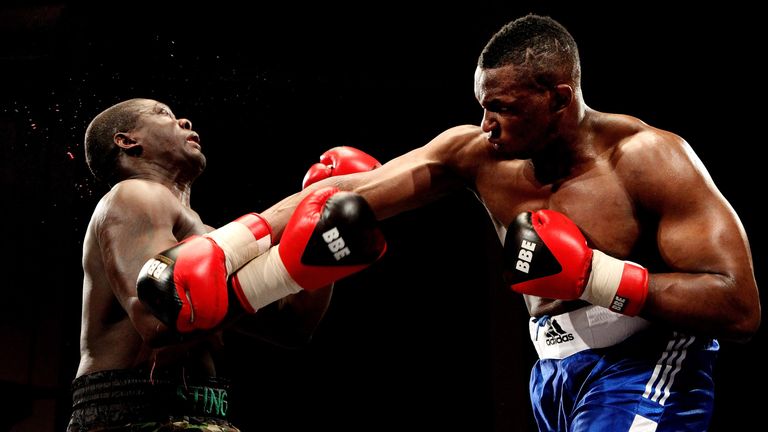 LIVERPOOL, ENGLAND - JANUARY 21:  Dillian Whyte (R) connects with Hastings Rassani during their Heavyweight bout at Liverpool Olympia on January 21, 2012 i