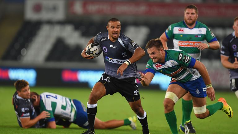 SWANSEA, WALES - SEPTEMBER 05:  Ospreys wing Eli Walker makes a break during the Guinness Pro 12 match between Ospreys and Benetton Rugby Treviso at Libert