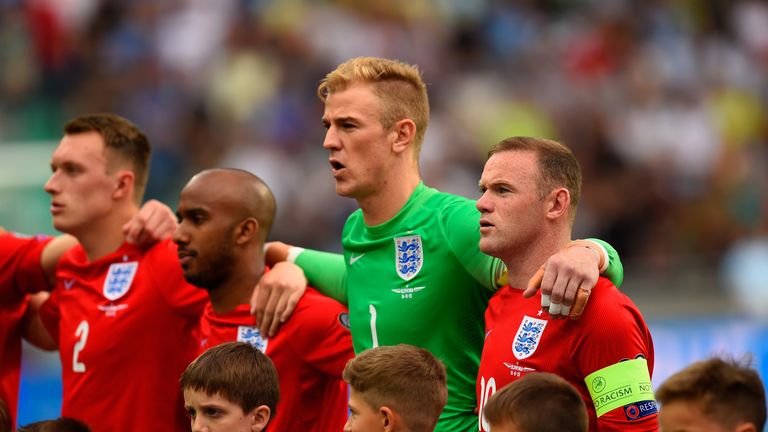 LJUBLJANA, SLOVENIA - JUNE 14:  (L-R) Phil Jones , Fabian Delph, Joe Hart and Wayne Rooney of England observe the national anthem during the UEFA EURO 2016