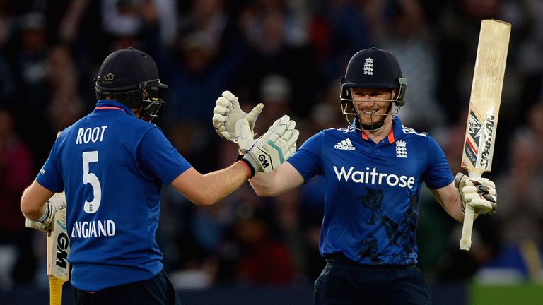 England captain Eoin Morgan celebrates with Joe Root after reaching his century 